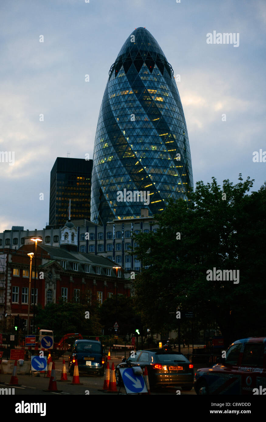 Gherkin building at dusk from Aldgate Stock Photo