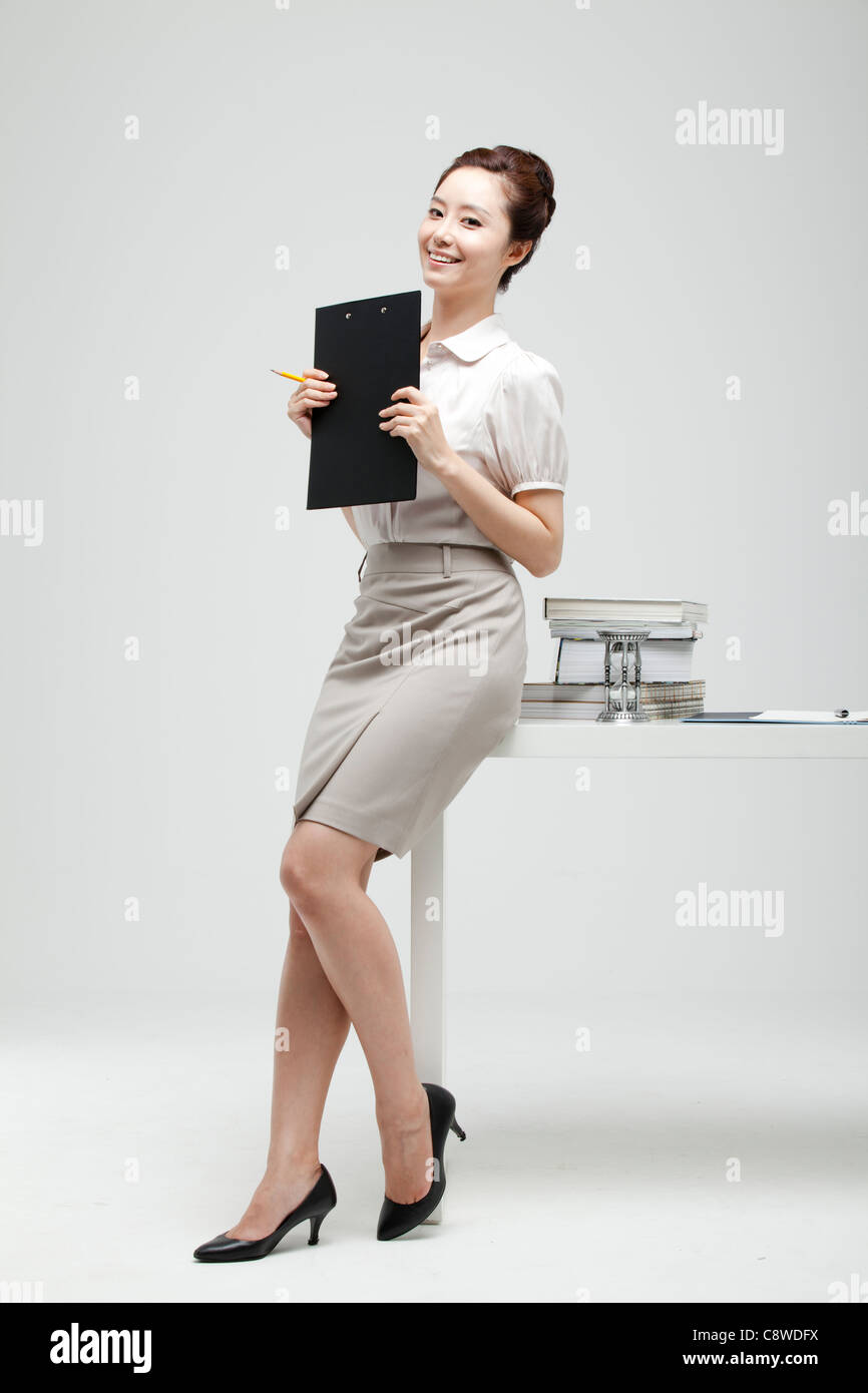 Leaning on desk hi-res stock photography and images - Alamy