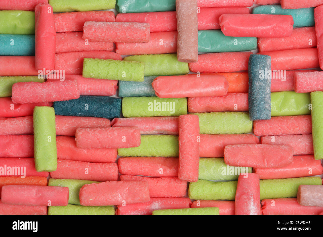 background composed of different colored chewy candies on white Stock Photo