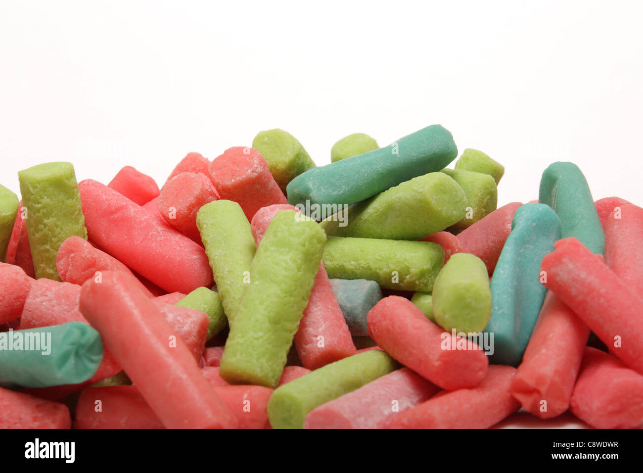 background composed of different colored chewy candies on white Stock Photo