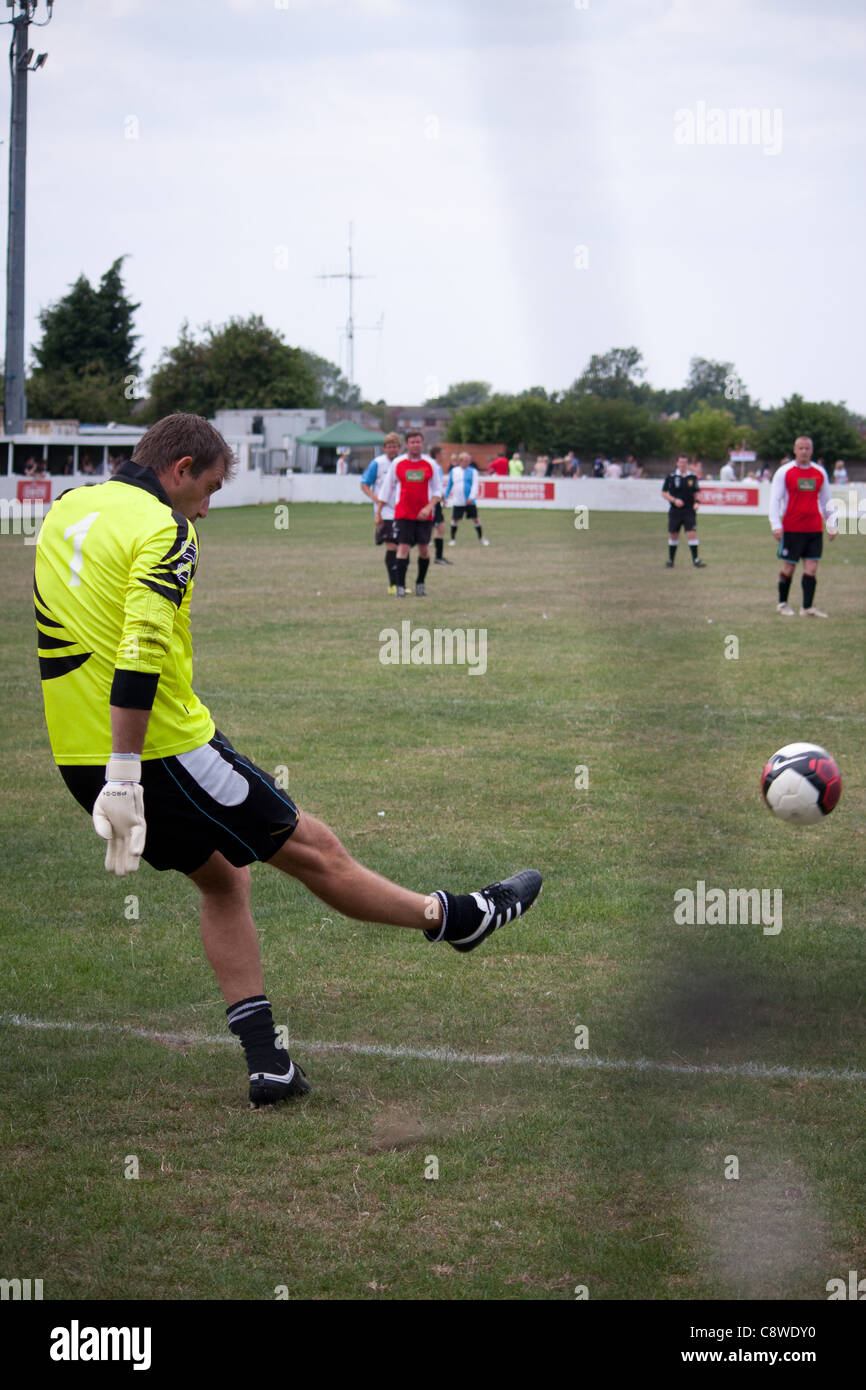 A local sports team football match showing men and women of all ages