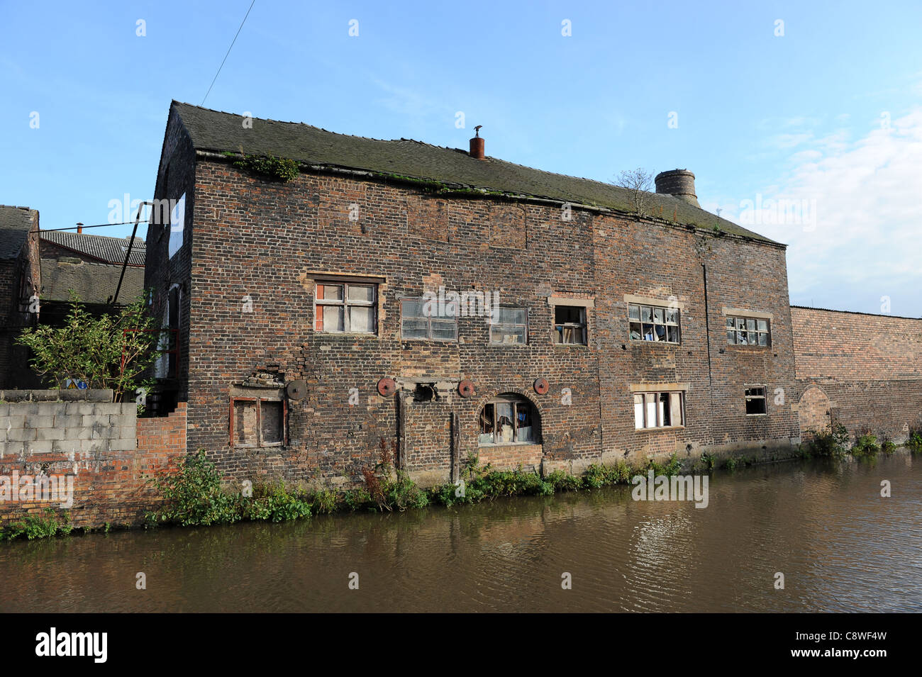 Derelict canalside buildings in Burslem Stoke on Trent Stock Photo