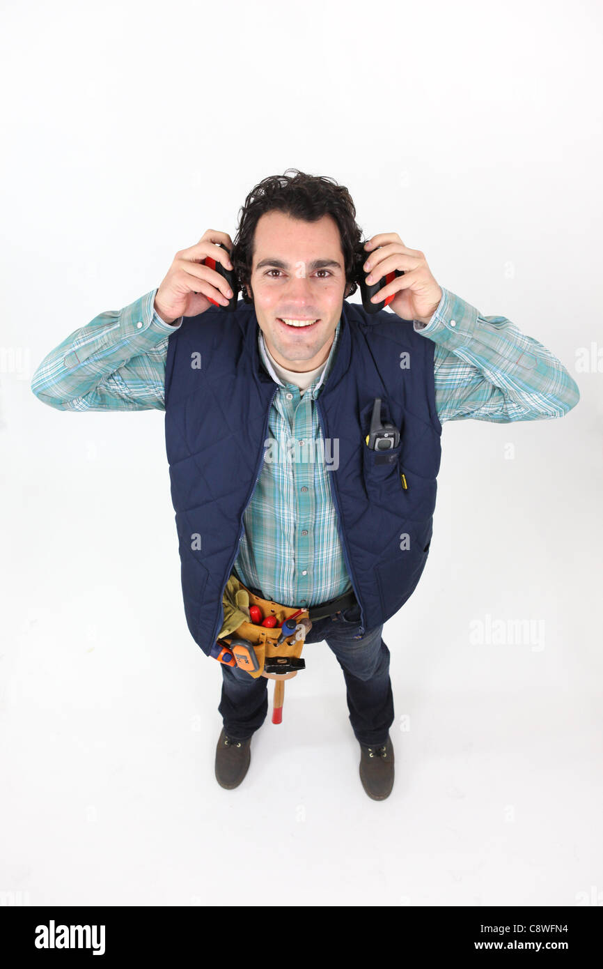 Worker wearing ear defenders Stock Photo Alamy