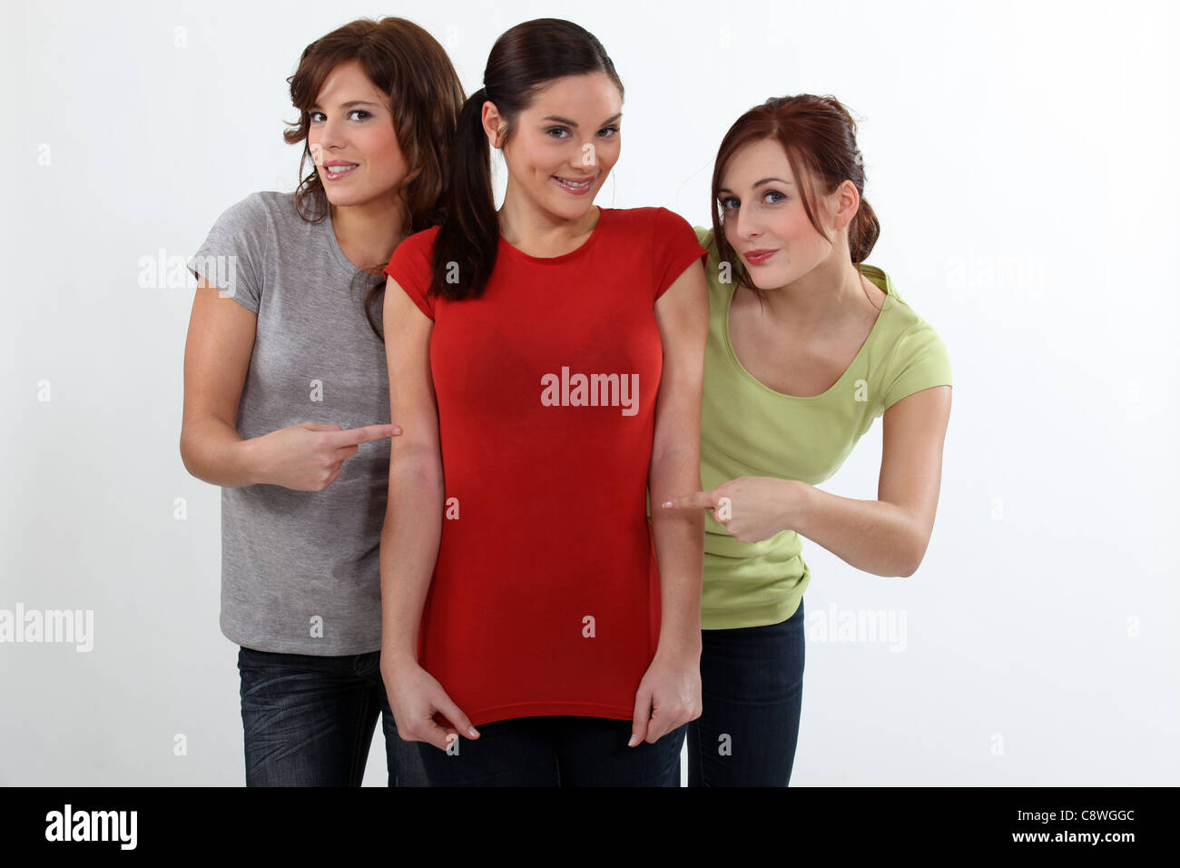 Women showing off their friend's new figure Stock Photo - Alamy