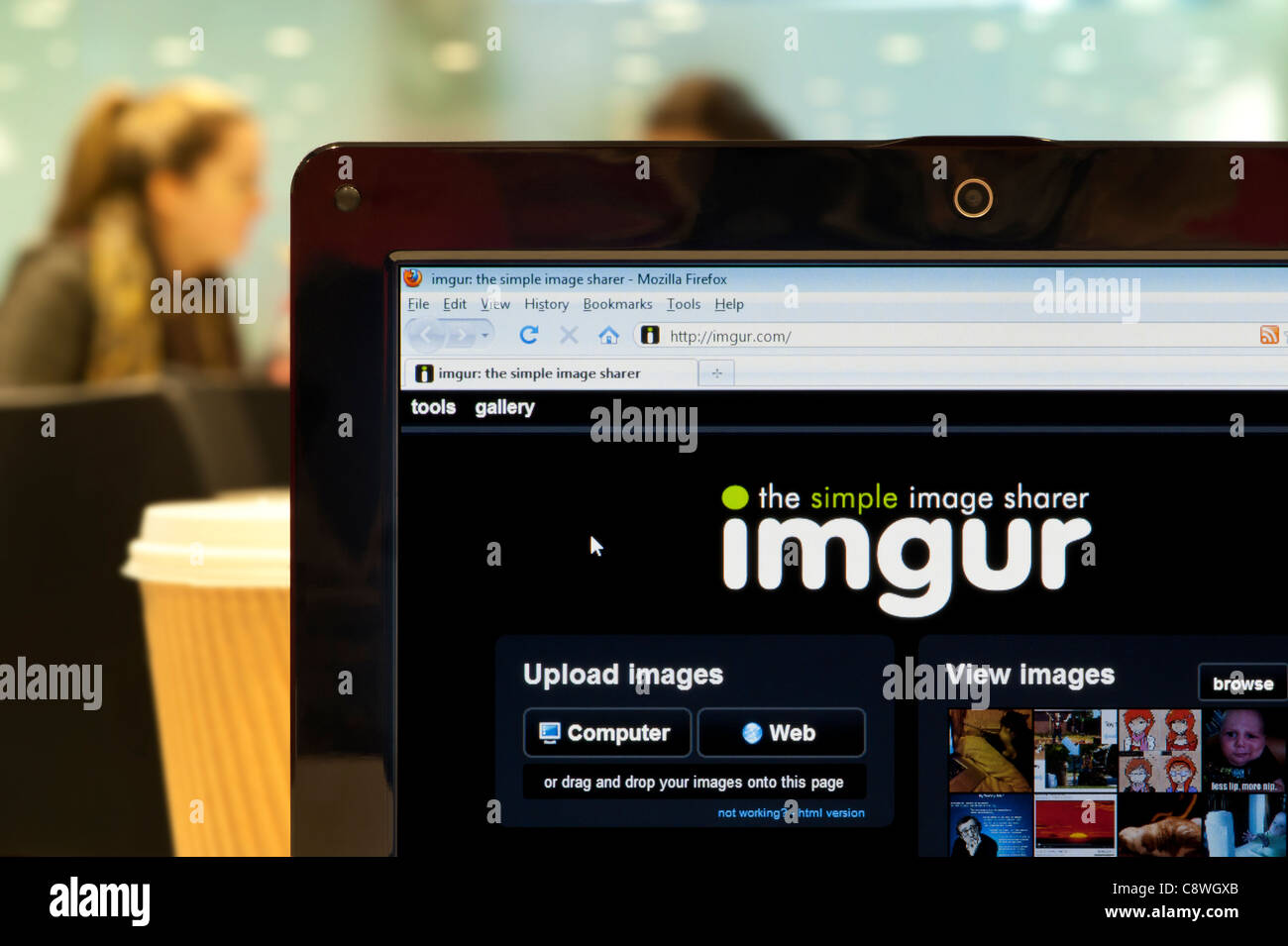 The Imgur website shot in a coffee shop environment (Editorial use only: print, TV, e-book and editorial website). Stock Photo