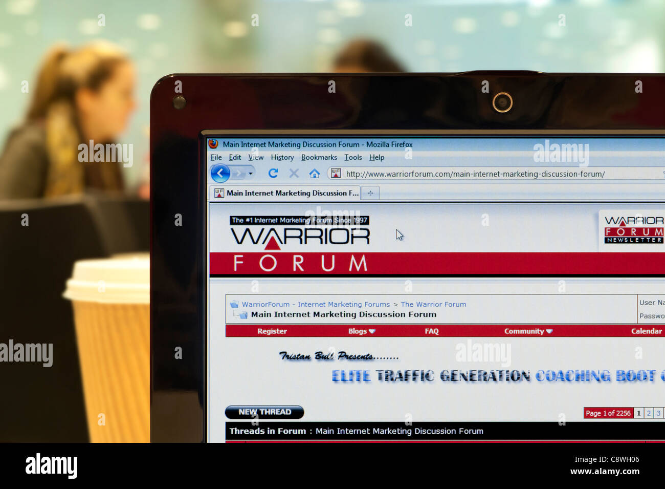 The Warrior Forum website shot in a coffee shop environment (Editorial use only: print, TV, e-book and editorial website). Stock Photo