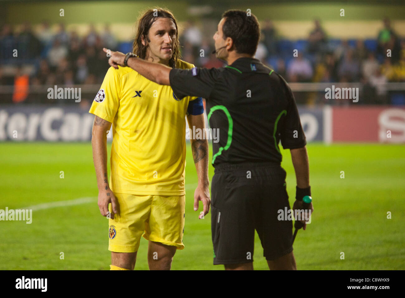 Gonzalo, Villareal CF defense, and the area referee assistant after the referee decided a penalty kick Stock Photo