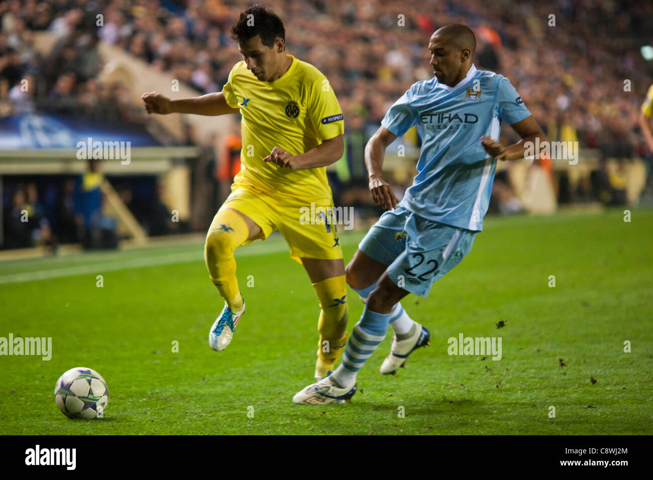 02/11/2011. Villareal, Spain Champions League - Villareal CF player Catalá and Manchester City player Clichy run for a ball Stock Photo