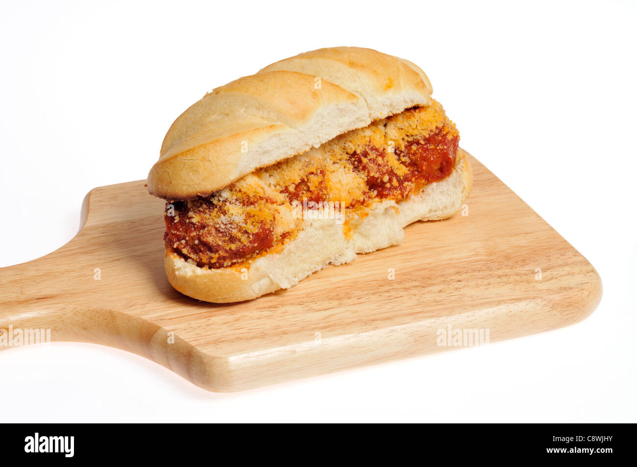 Meatball sub with cheese and tomato sauce on white hoagie roll on a wood deli board Stock Photo
