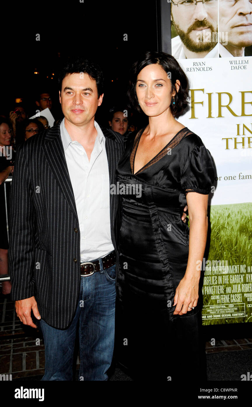 Carrie-Anne Moss husband Steven Roy arrivals FIREFLIES INGARDEN Premiere Pacific Theaters atGrove Los Angeles CA October 12 Stock Photo
