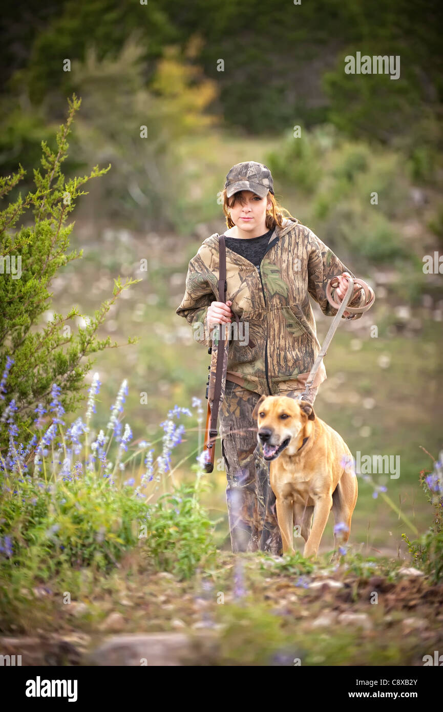 Female hunter with hunting dog hound Stock Photo