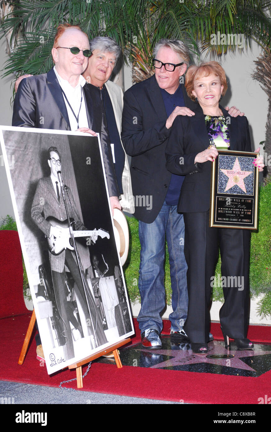 (From left) Peter Asher, Phil Everly, Gary Busey, Maria Elena Holly (with picture of Buddy Holly) at the induction ceremony for Stock Photo