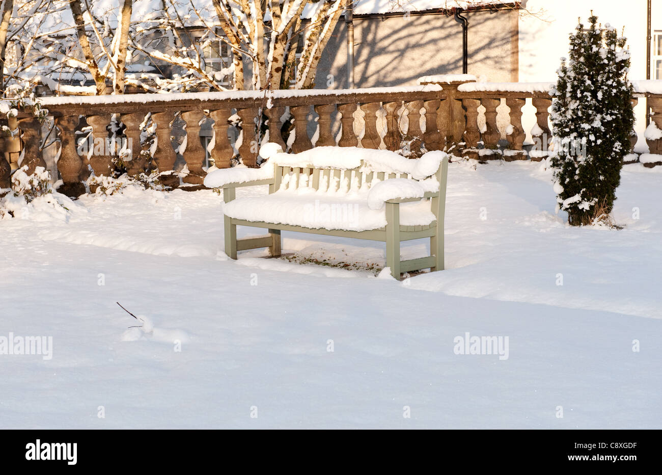 Beautiful view on the bench covered with snow Stock Photo