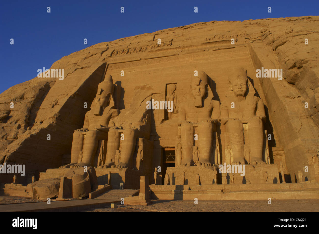 Egyptian art. Great Temple of Ramses II. Four colossal statues depicting the pharaoh Ramses II (1290-1224 BC). Abu Simbel. Egypt Stock Photo