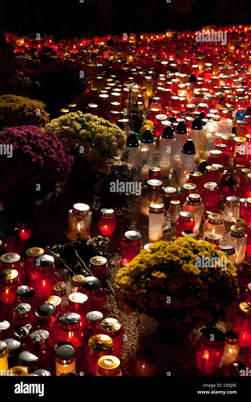 Flowers and lighten candles on All Saints' day. Stock Photo