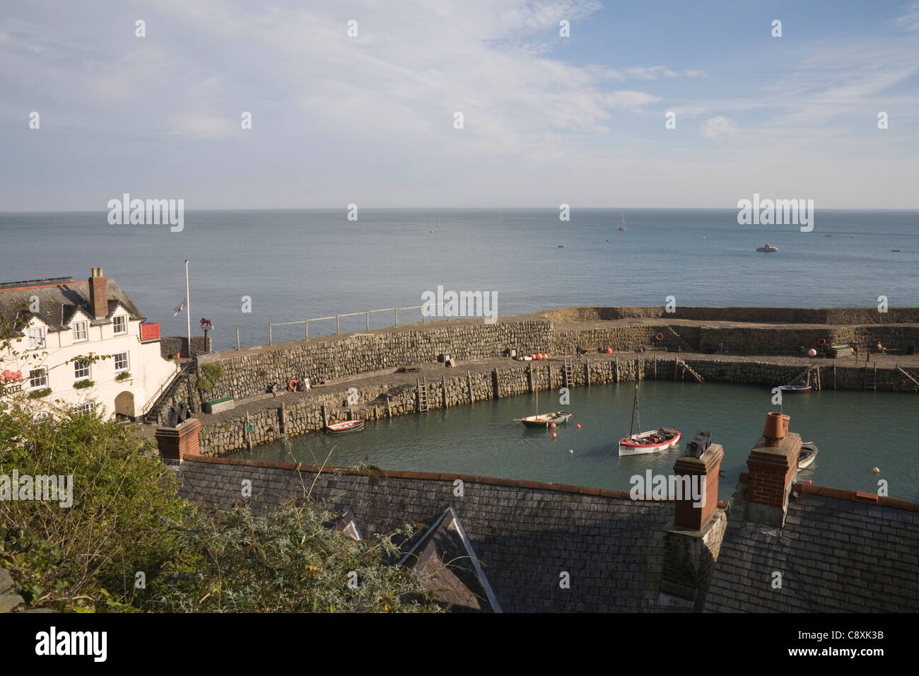 Clovelly North Devon October Looking down on harbour of private fishing village with Red Lion Hotel at waterfront Stock Photo