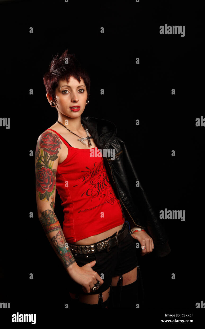 young woman with tattoos on her arm, youth culture, body art Stock Photo