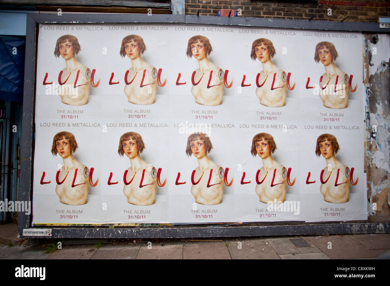 Billboard displaying promotional posters of Metallica and Lou Reed's album,  Lulu, London, England, UK Stock Photo - Alamy