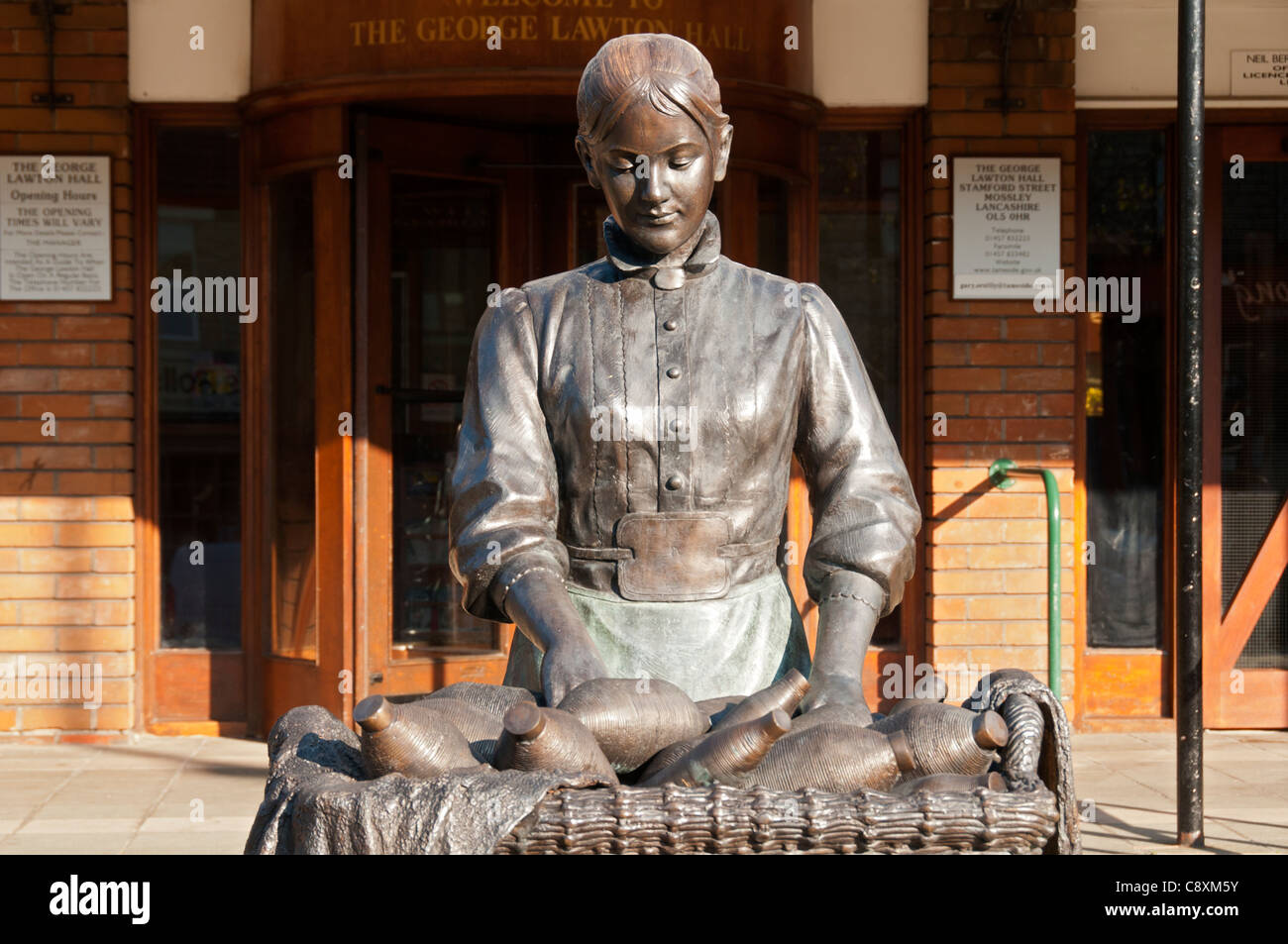 The Mossley Mill Girl. A sculpture in Mossley, Tameside, Manchester, UK. A tribute to the women in the town's industrial past. Stock Photo