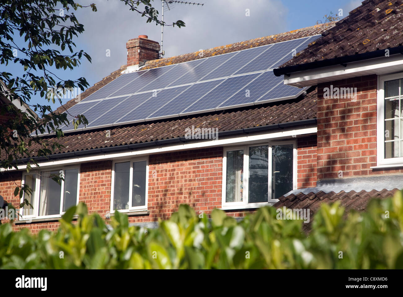 Large array of solar panels on domestic house roof Stock Photo Alamy