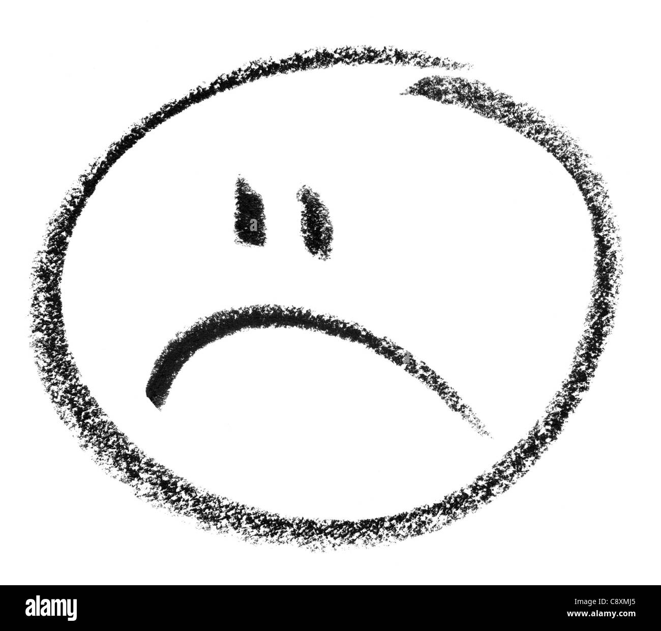 crayon painted unhappy smiley in white back Stock Photo