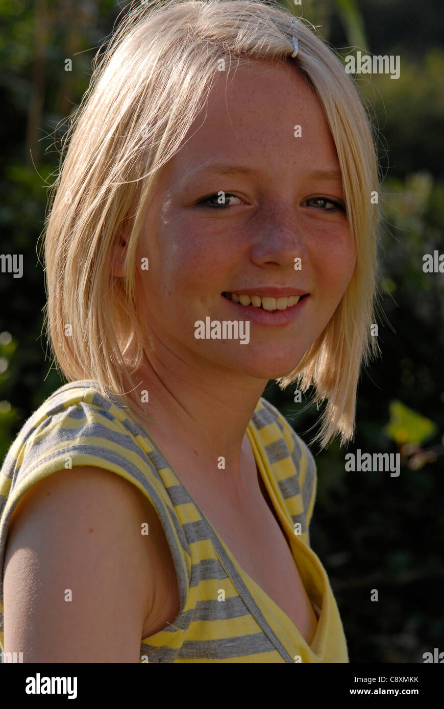 Head and shoulders portrait of a smiling teenage girl Stock Photo - Alamy