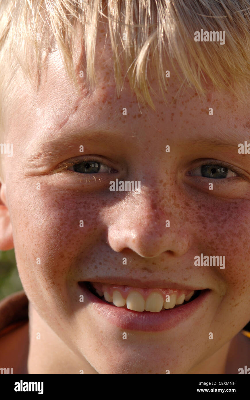 Head shot of a boy with blond hair and freckles Stock Photo - Alamy