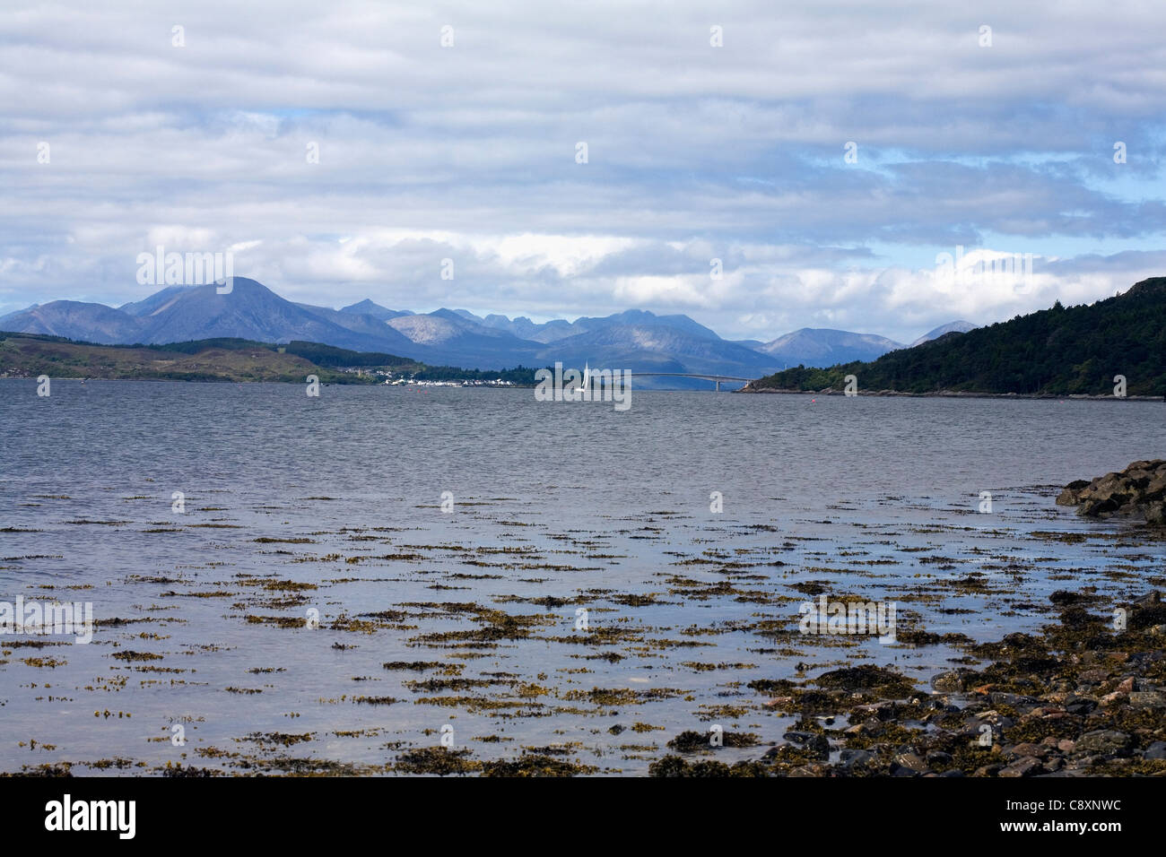 Loch Alsh looking  toward the Skye Bridge  The Kyle of Lochalsh and the Red Cuillin Scotland Stock Photo