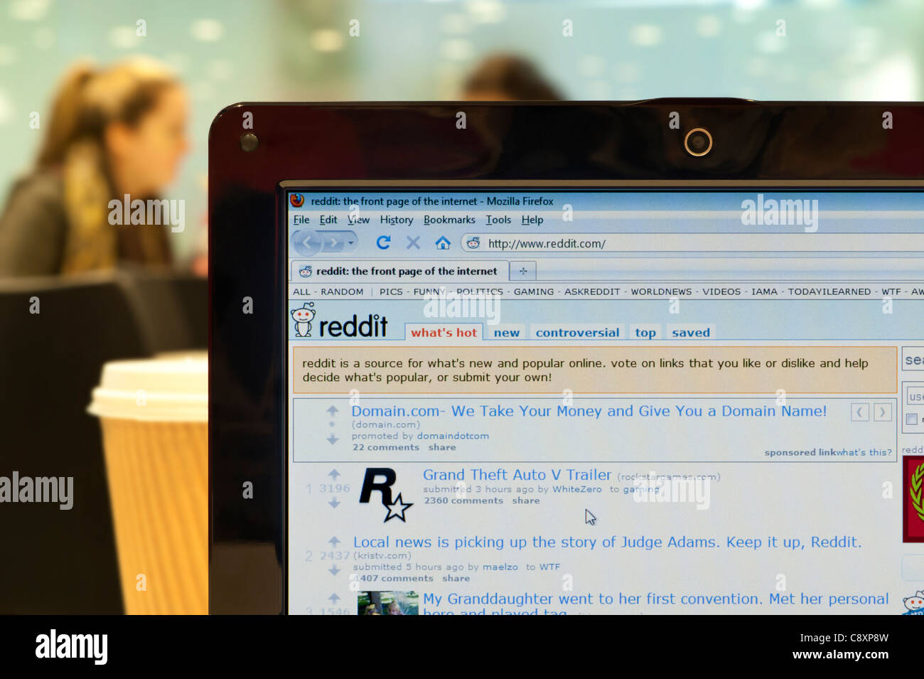 The Reddit website shot in a coffee shop environment (Editorial use only: print, TV, e-book and editorial website). Stock Photo