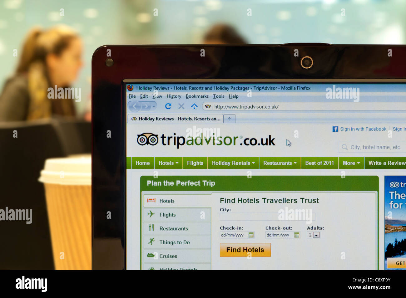 The Trip Advisor website shot in a coffee shop environment (Editorial use only: ­print, TV, e-book and editorial website). Stock Photo
