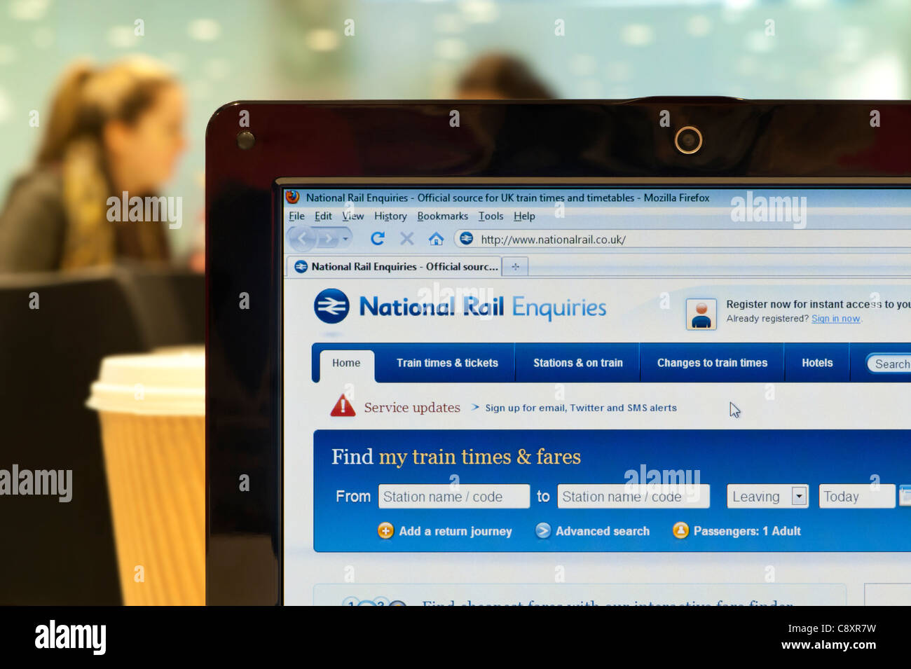 The National Rail website shot in a coffee shop environment (Editorial use only: print, TV, e-book and editorial website). Stock Photo