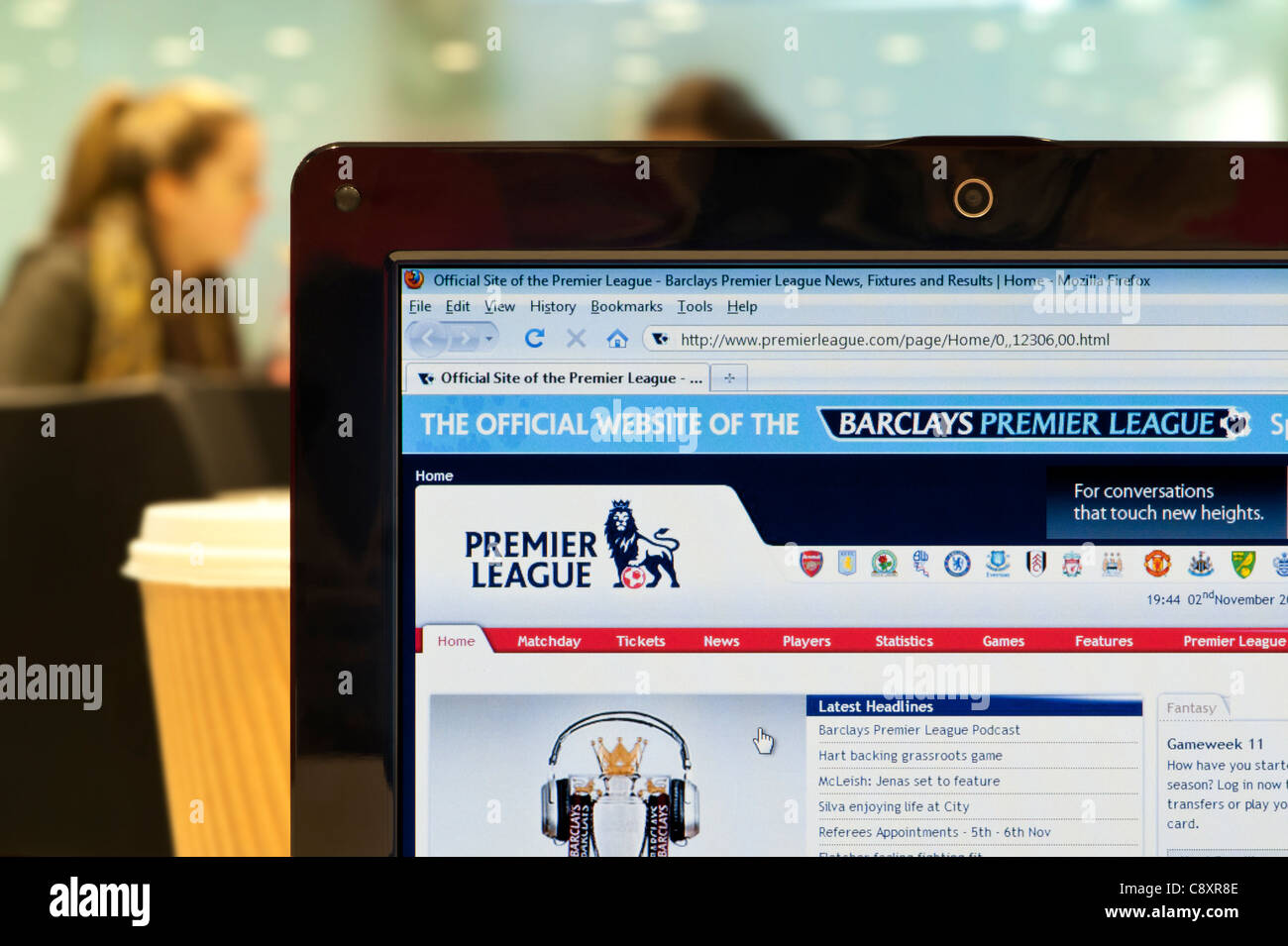 The Premier League website shot in a coffee shop environment (Editorial use only: print, TV, e-book and editorial website). Stock Photo