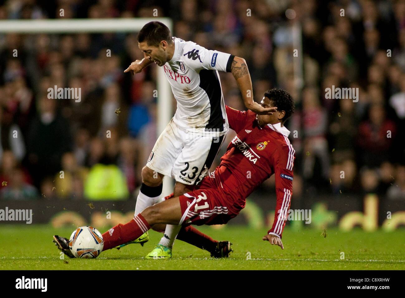 03.11.2011, London, England. Fulham's American midfielder Clint Dempsey is fouled by Krakow's Dutch defender Michael Lamey during the UEFA Europa League Group football match between Fulham v Wisla Krakow from Poland, played at Craven Cottage.  Mandatory credit: ActionPlus Stock Photo