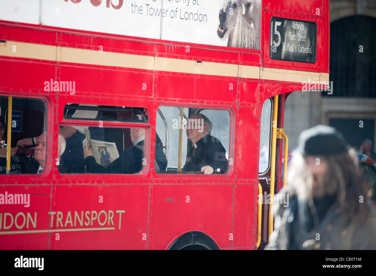 Vicar on number 15 Bus in The Strand London Stock Photo