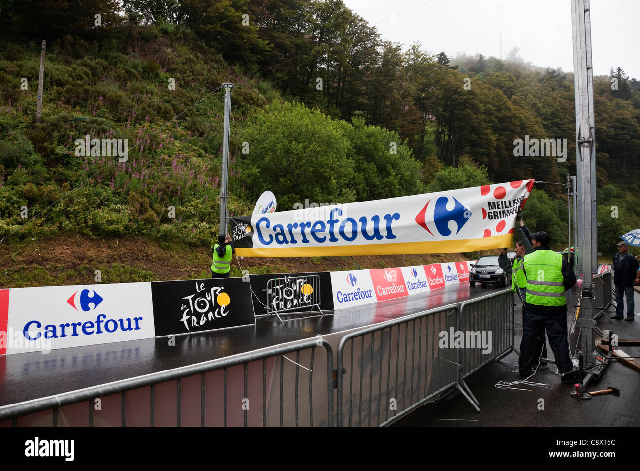 Workmen preparing the Mountain Top banners on Col de Cere, Stage 9, Tour de France Cycle Race 2011 Stock Photo