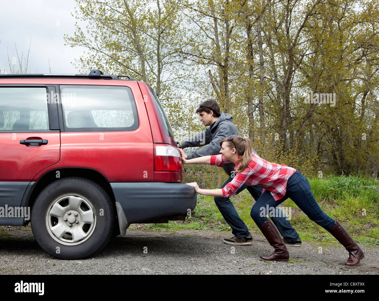 usa oregon ashland young couple pushing car stock photo 39927830