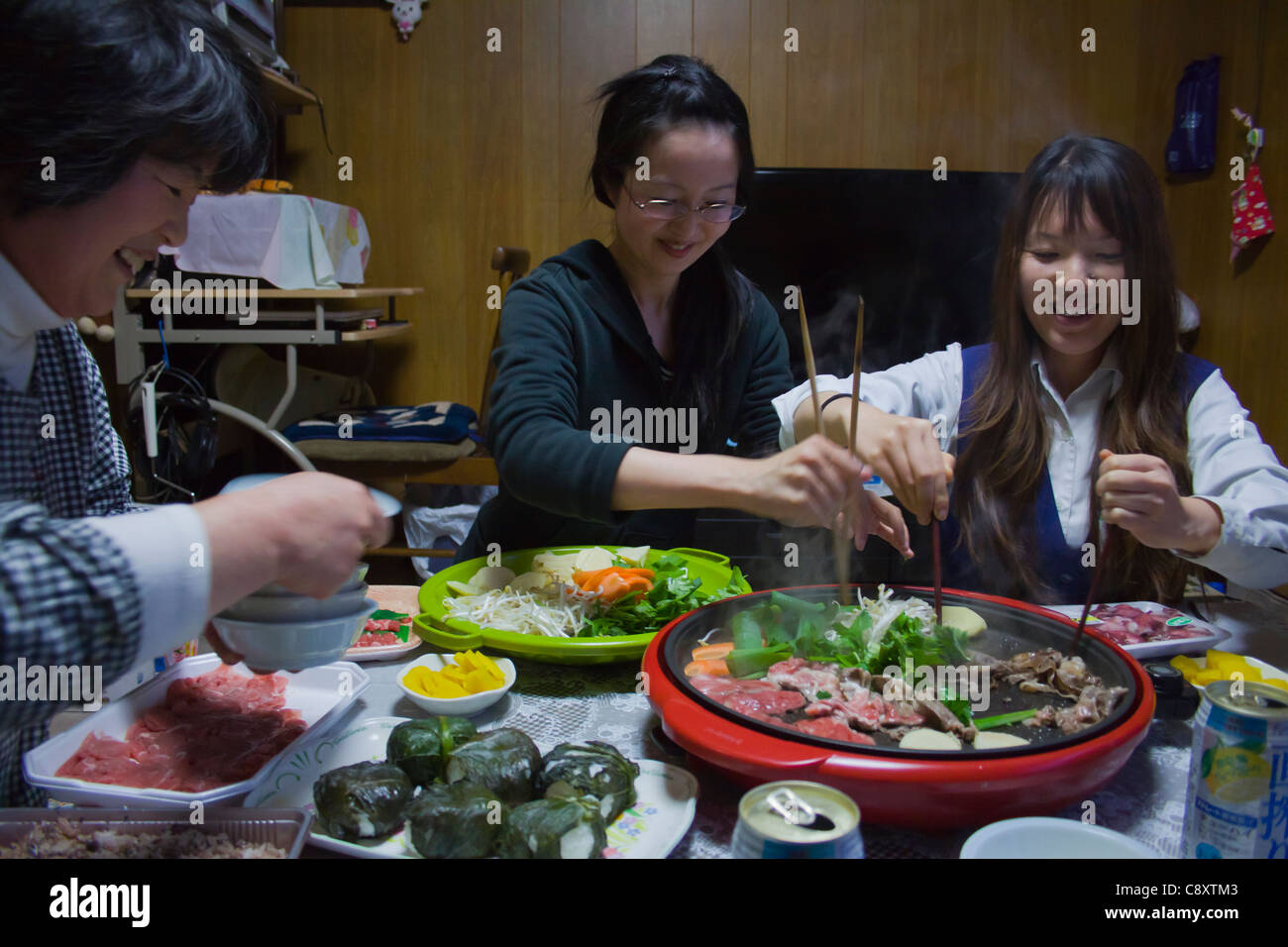 Japanese family cooking dinner Stock Photo Alamy