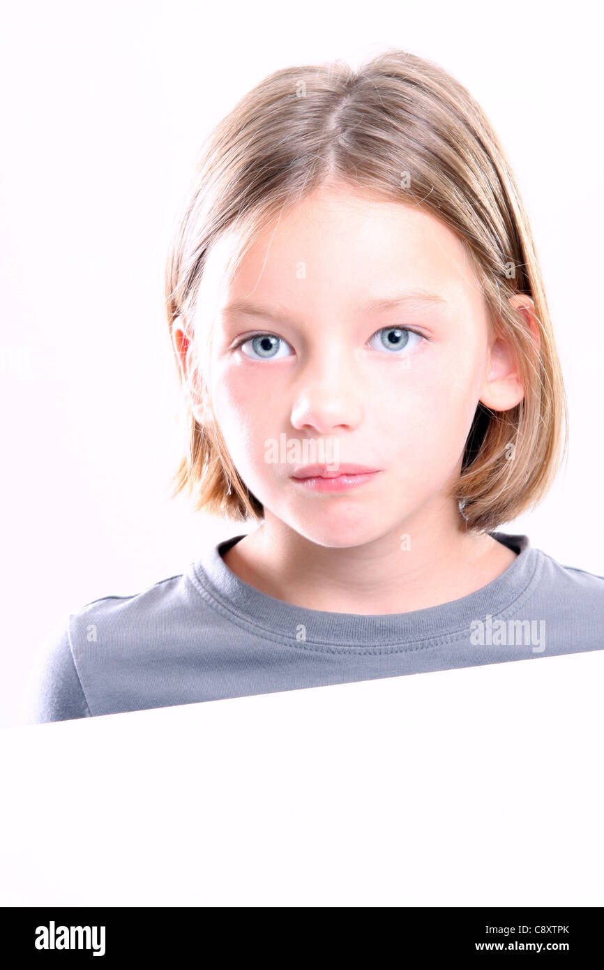 A young girl holding a white sign Stock Photo - Alamy