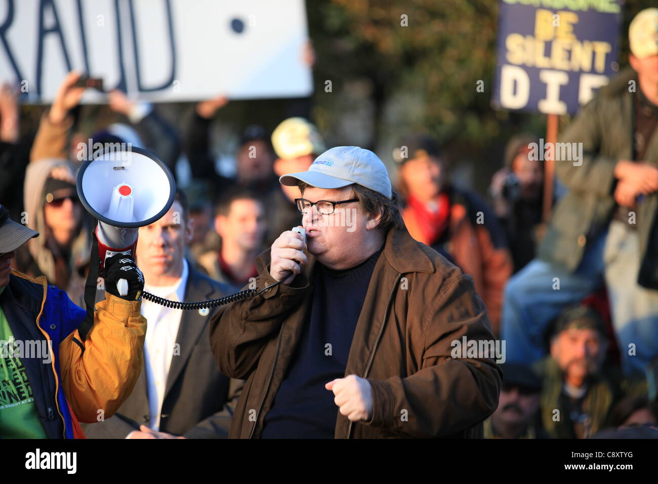 Denver, Colorado - Academy Award winning filmmaker and bestselling author Michael Moore addresses a crowd of Occupy Denver demonstrators at City Park in Denver on Thursday, November 03, 2011.  Moore is in Denver to promote his latest book entitled “Here Comes Trouble: Stories from My Life”. Stock Photo