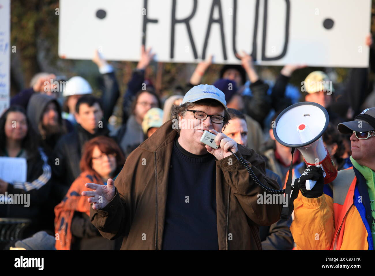 Denver, Colorado - Academy Award winning filmmaker and bestselling author Michael Moore addresses a crowd of Occupy Denver demonstrators at City Park in Denver on Thursday, November 03, 2011.  Moore is in Denver to promote his latest book entitled “Here Comes Trouble: Stories from My Life”. Stock Photo