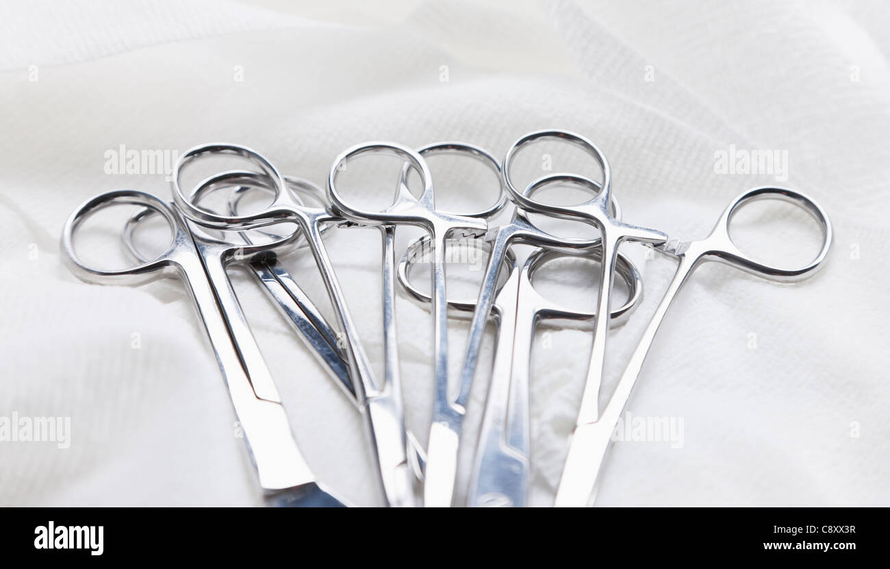 Surgical scissors and clamps on white background, studio shot Stock