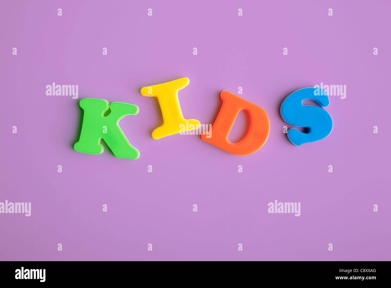 Studio shot of letter magnets forming word kids Stock Photo