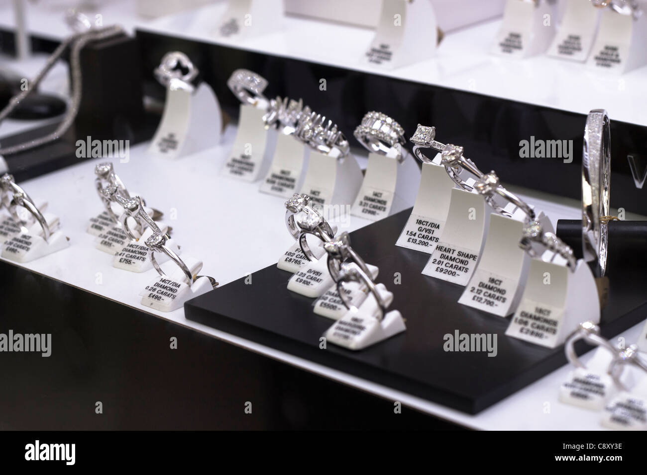 Detail of shop window displayed engagement diamond rings Stock Photo