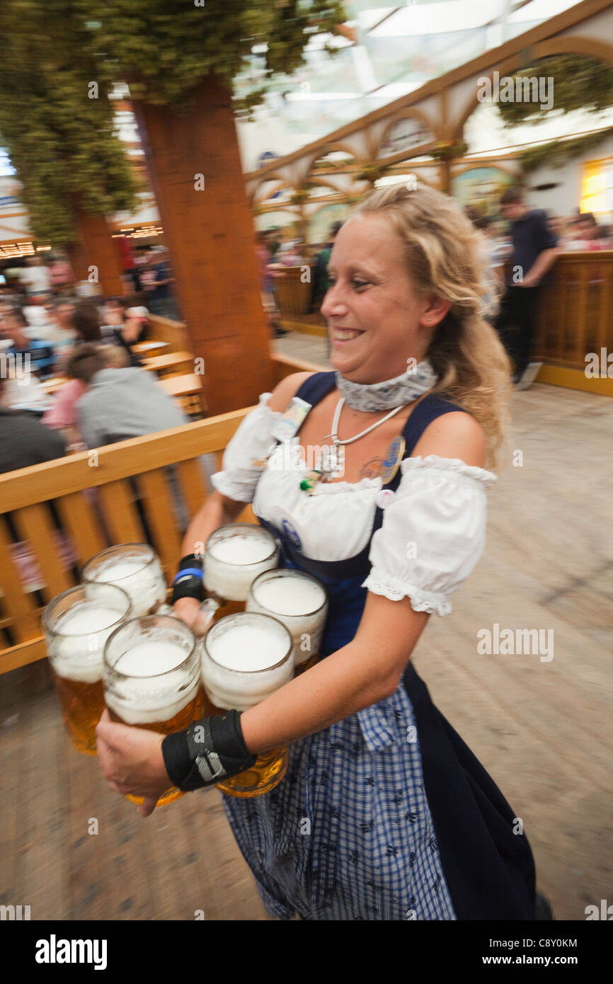 oktoberfest girl carrying beer