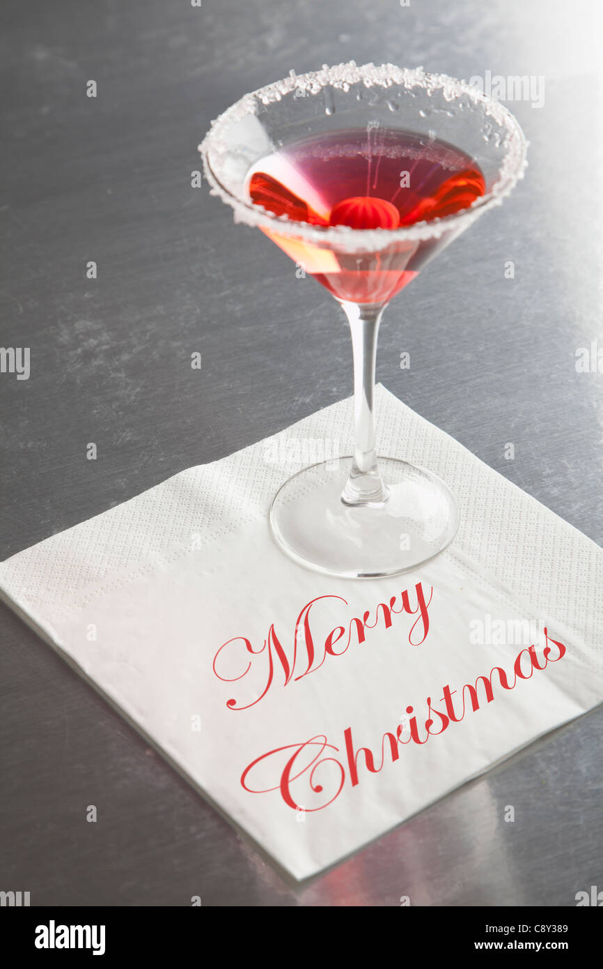 USA, Illinois, Metamora, Martini glass with 'Merry Christmas' napkin Stock Photo
