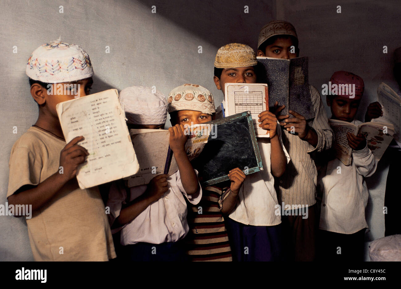 Shy boys in a koranic school ( a 'madarsa') ( India) Stock Photo