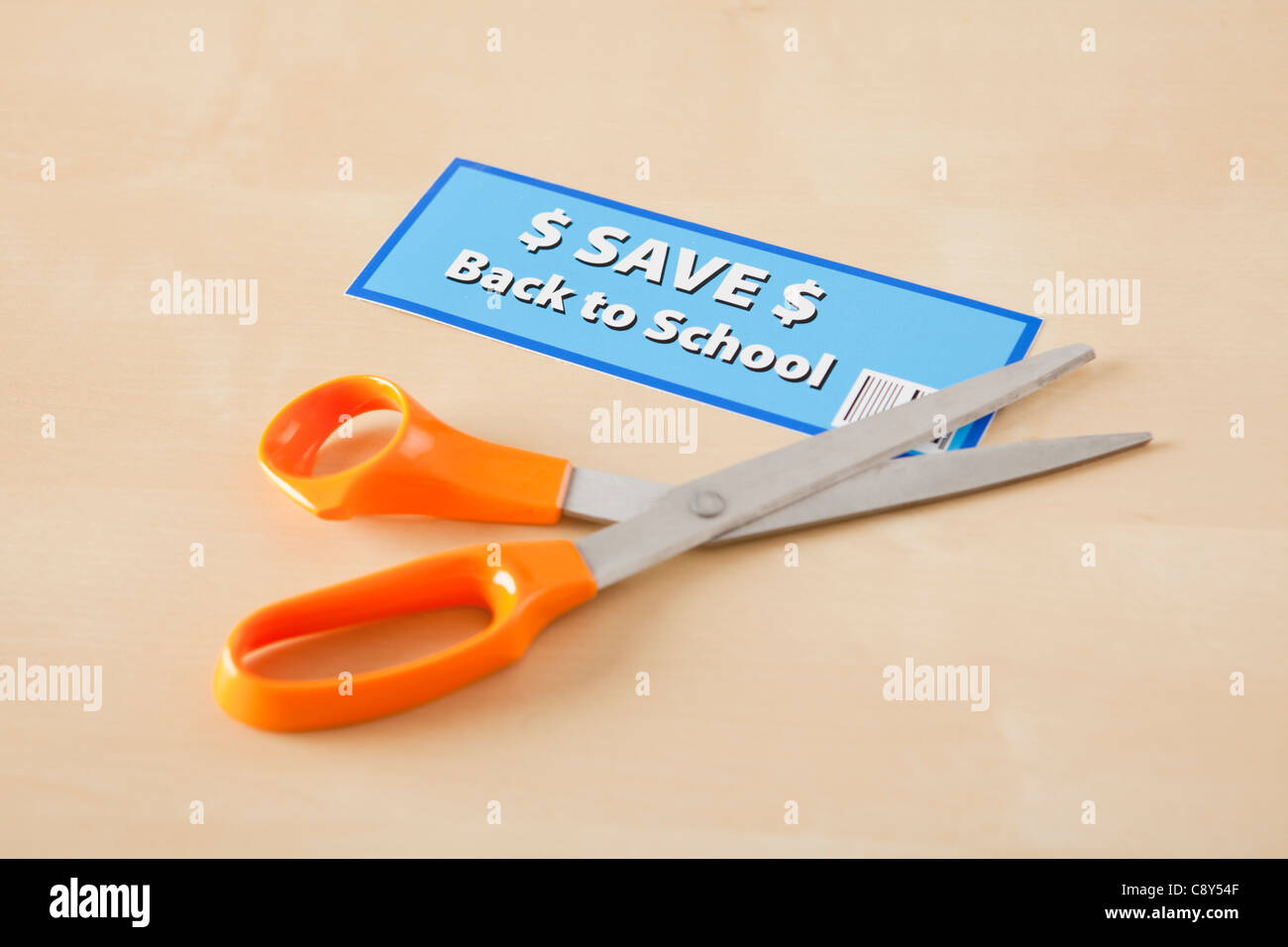 Studio shot of scissors and coupon Stock Photo