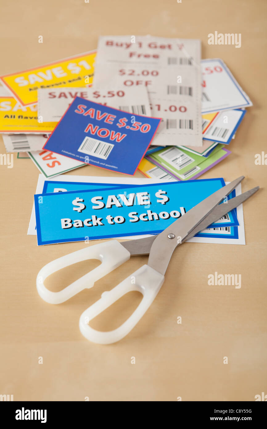 Studio shot of scissors and coupons Stock Photo