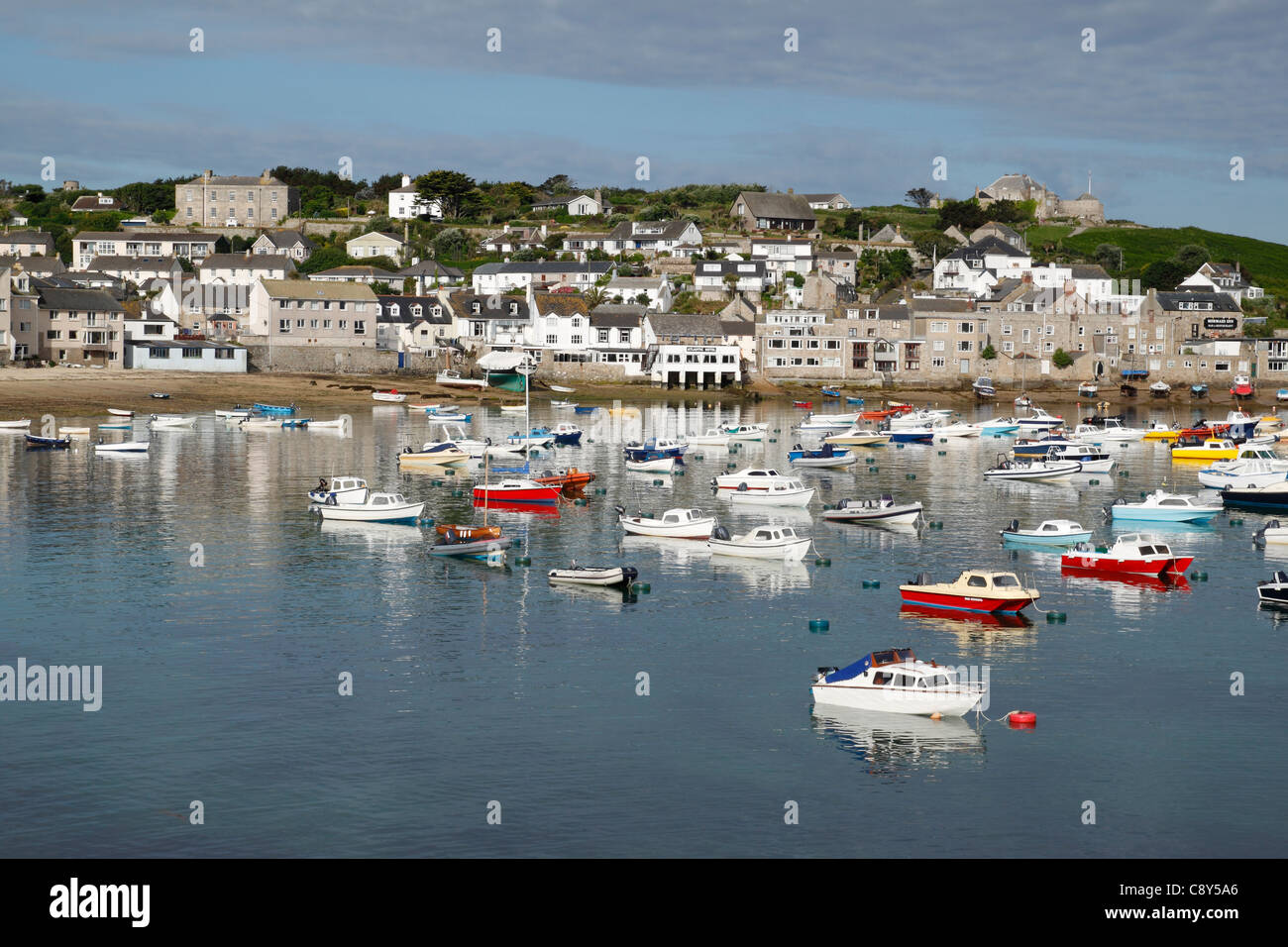 Boats in St. Mary's harbour on a still summer morning, Isles of Scilly, Cornwall UK. Stock Photo