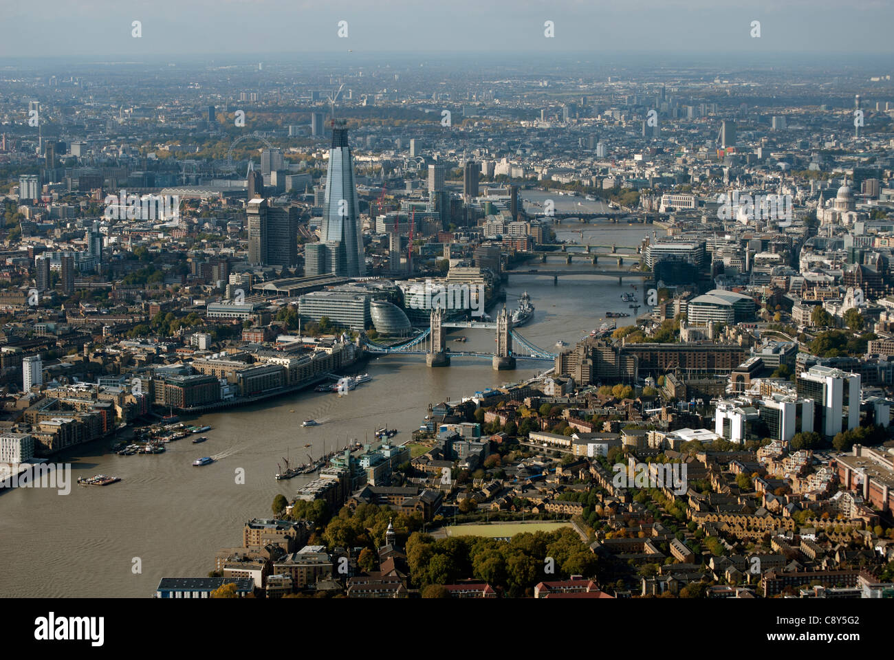 The River Thames with Tower Bridge in London England UK from the air ...